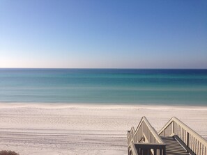 A beach with a wooden staircase leading down to the sand. - Mediterannean Home Steps to 30As Longest Public Beach,Private Pool,Courtyard (Santa Rosa Beach)