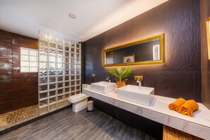 A modern bathroom with a glass shower enclosure, two sinks, a large mirror, and a potted plant. - Finca Casa Varna with Mountain View, Pool, Terrace & Garden; Parking Available (Capdepera)