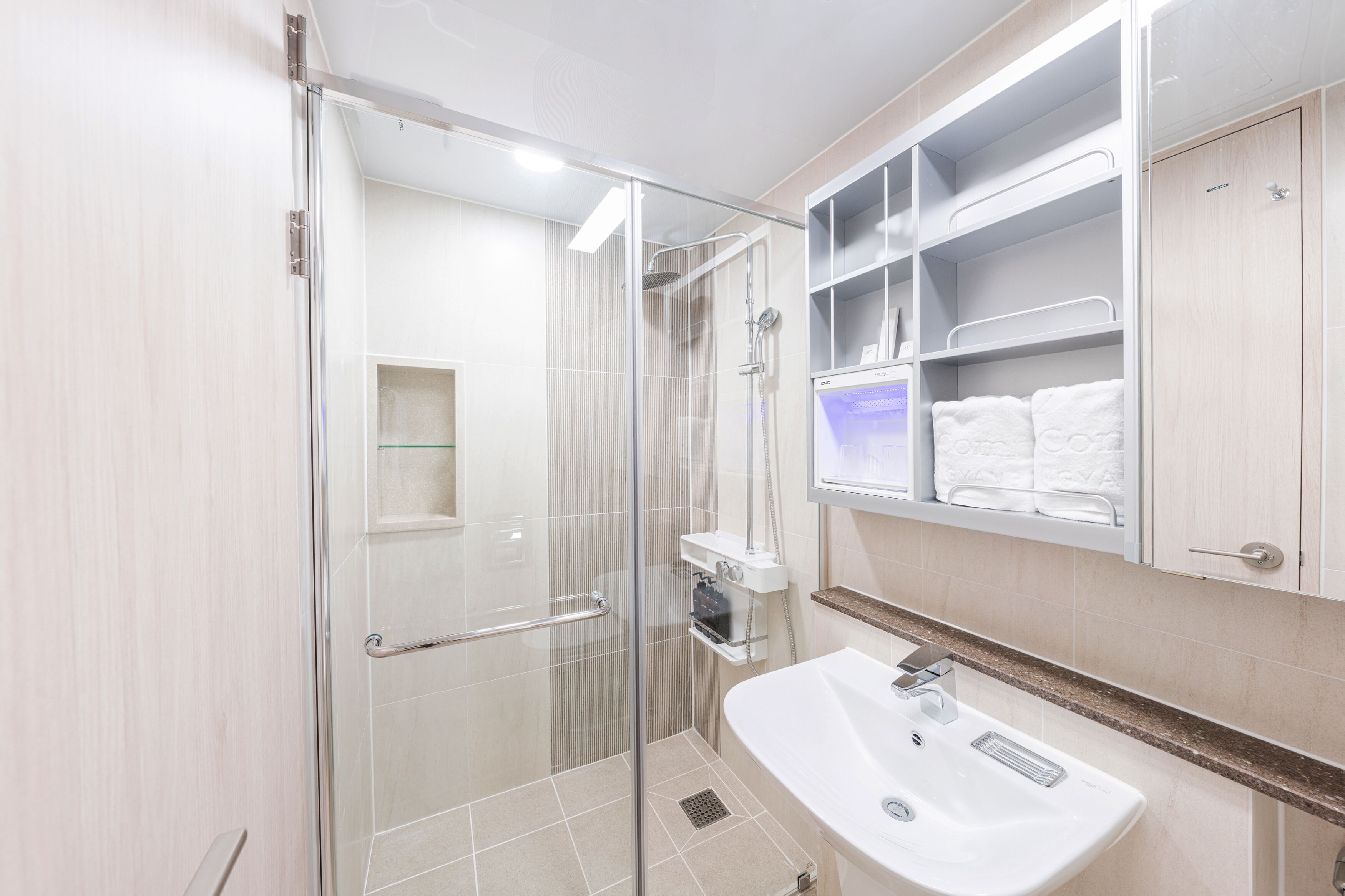 shower, rainfall showerhead, hair dryer, towels