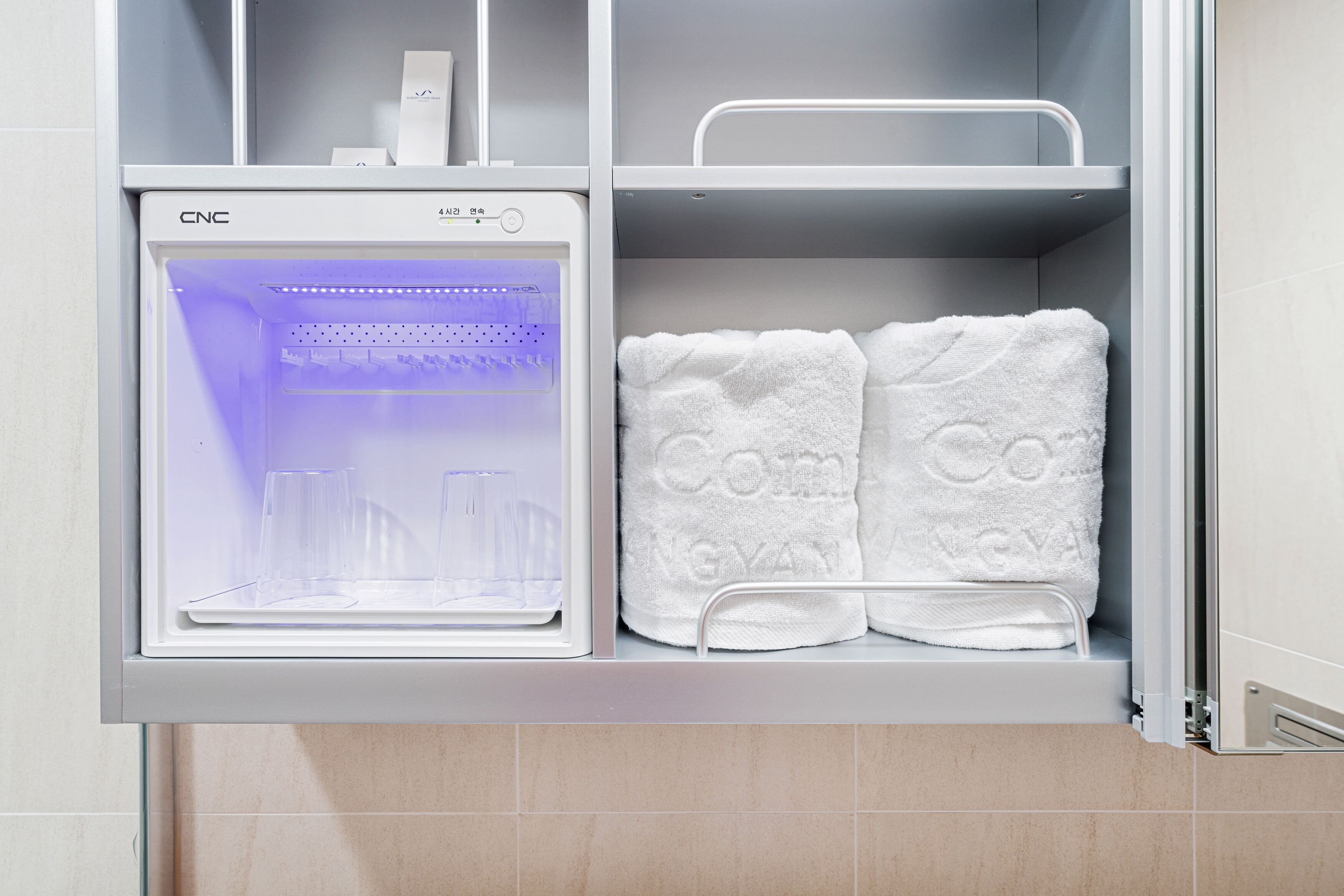 shower, rainfall showerhead, hair dryer, towels