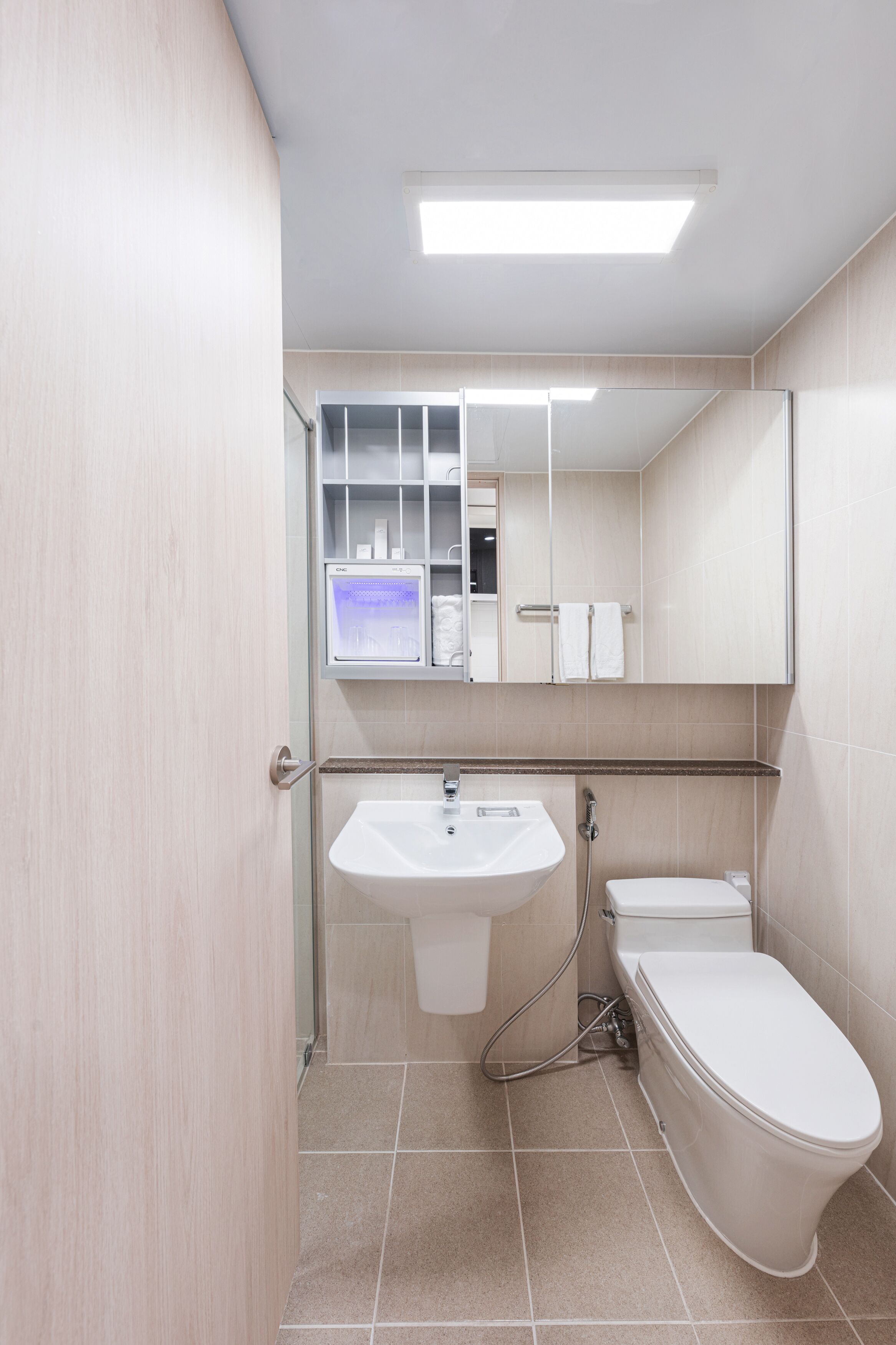 shower, rainfall showerhead, hair dryer, towels