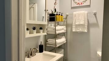Combined shower/tub, hair dryer, towels, soap
