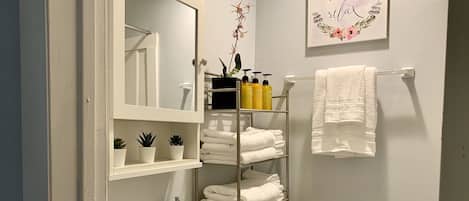 Combined shower/tub, hair dryer, towels, soap