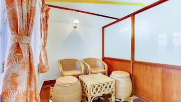 Deluxe Double Room | Living area | Flat-screen TV