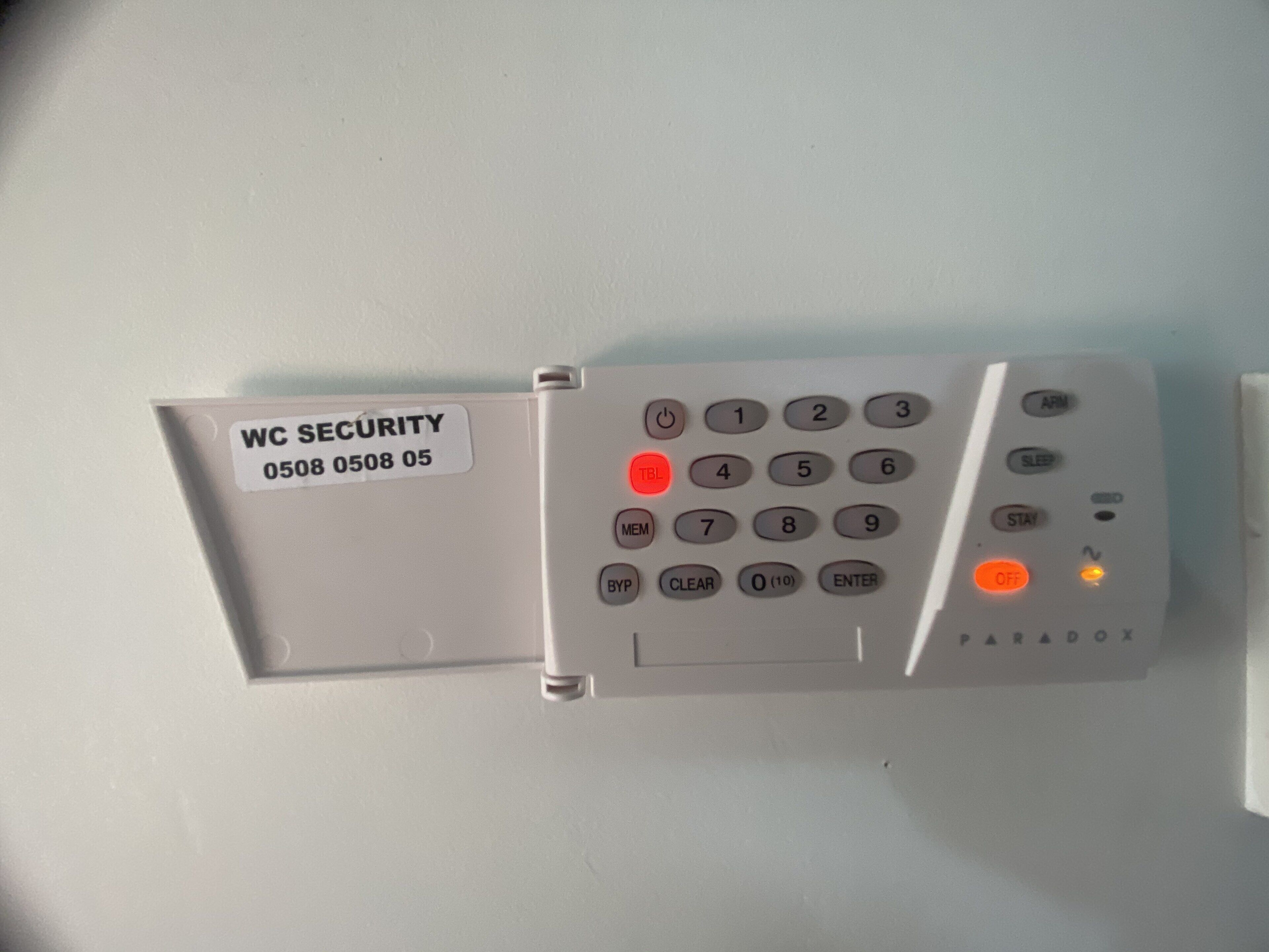 A WC security panel with a keypad and a card slot.