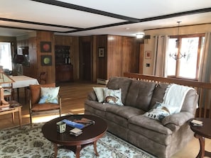 Smart TV, fireplace, books, computer monitors