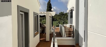 Unwind at this front-line private luxury villa with panoramic golf and sea views
