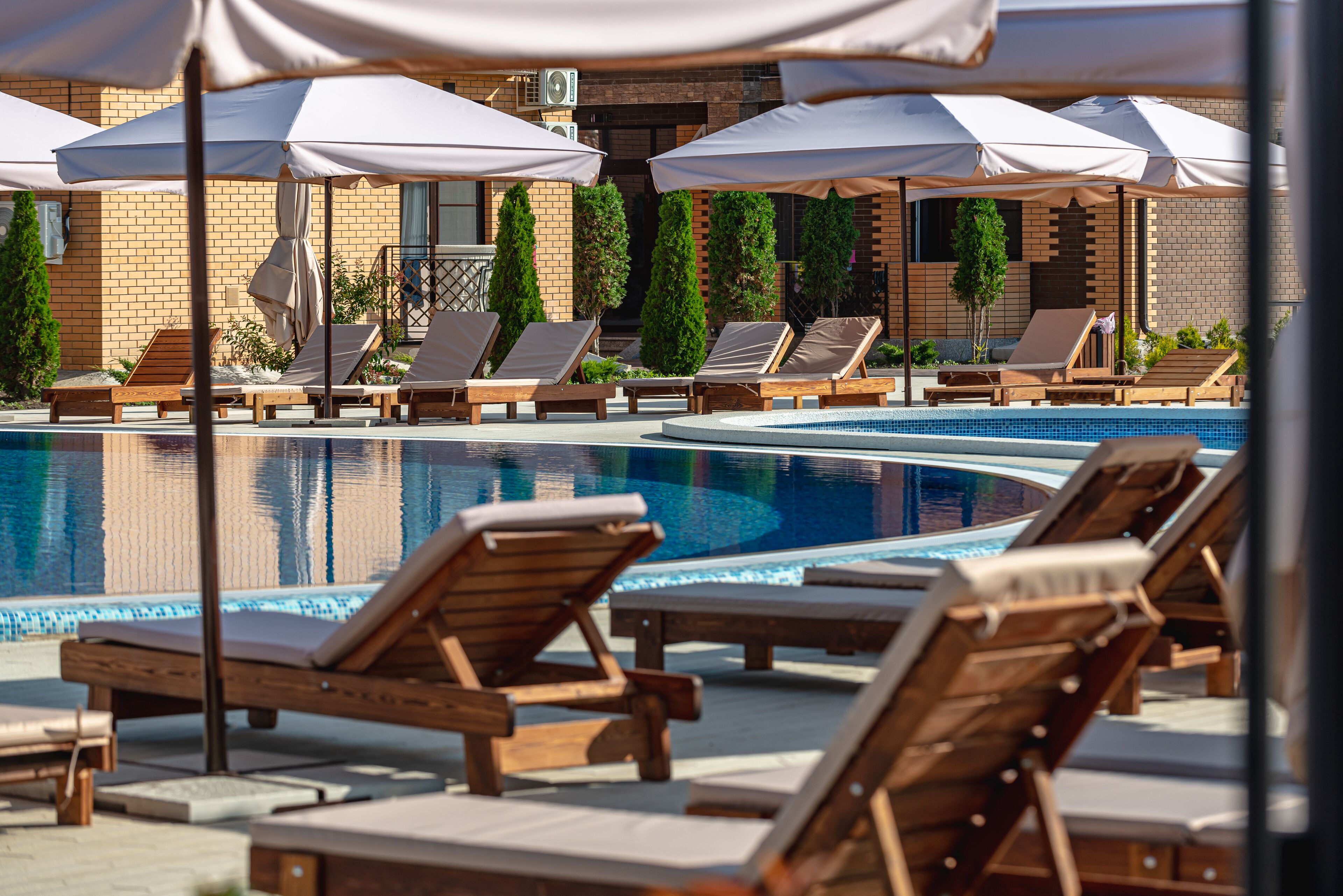 Seasonal outdoor pool, pool umbrellas, pool loungers