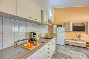 Family Apartment, Multiple Bedrooms, Mountainside (Orange Apartment Sea View) | Private kitchen | Fridge, microwave, oven, stovetop