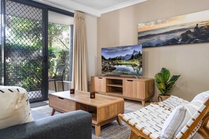 TV, offices - 2-Bed Family Haven with Pools, BBQ & Playgrounds (Mermaid Beach)