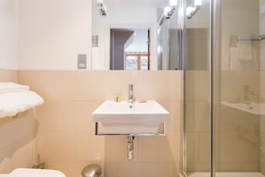 Combined shower/tub, hair dryer, towels, soap