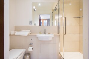 Combined shower/tub, hair dryer, towels, soap