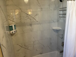 Bathtub, hair dryer, towels
