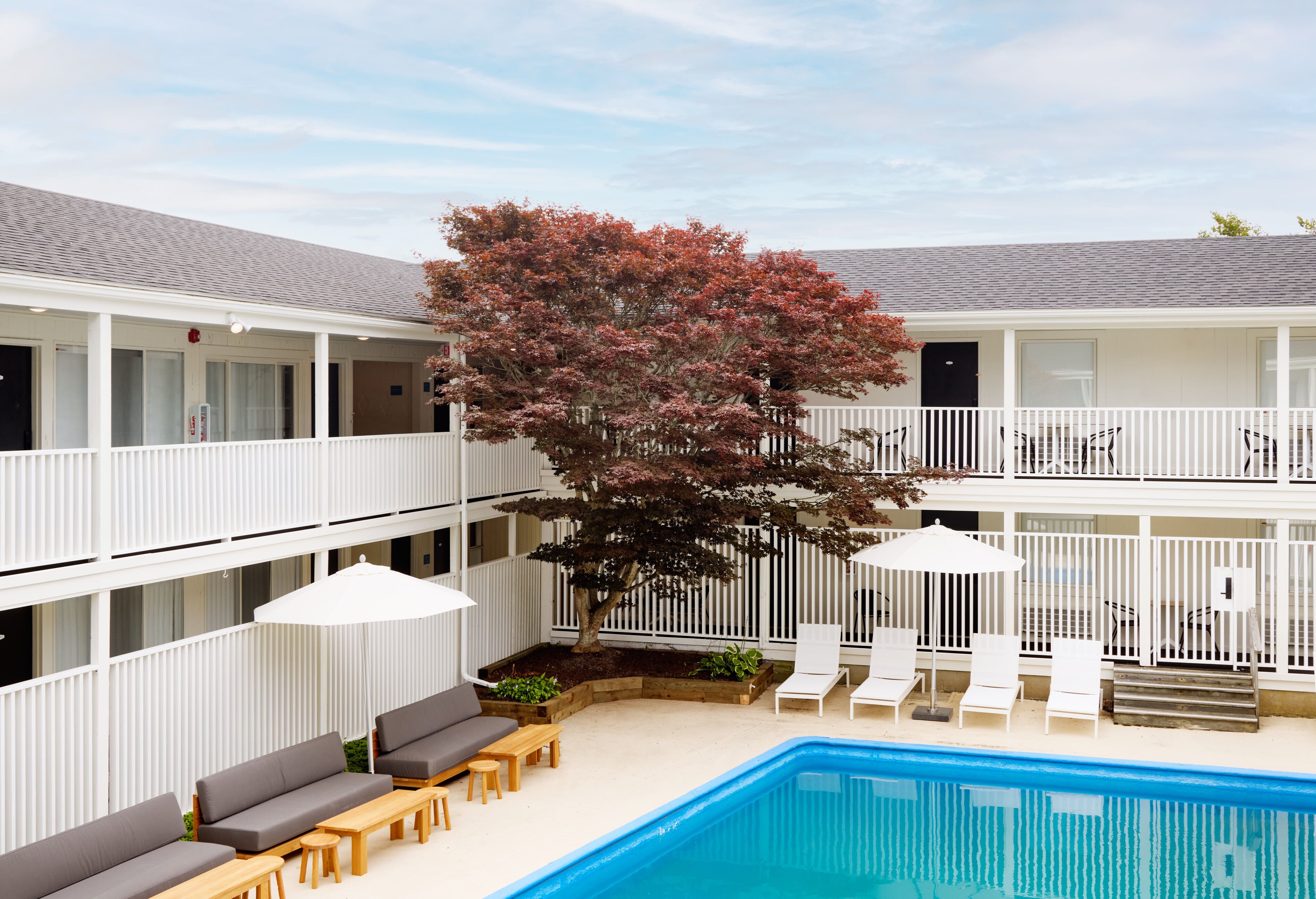 seasonal outdoor pool, open 9:00 am to 9:00 pm, pool umbrellas