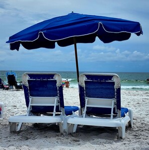 On the beach, sun-loungers
