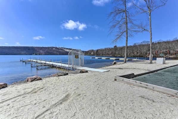 Enjoy a serene lakeside retreat with access to the water via the dock and a scenic boardwalk.