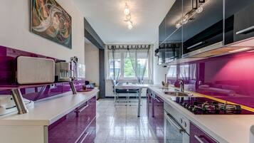 Comfort Apartment | Private kitchen | Fridge, coffee/tea maker, electric kettle, dining tables