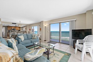 Spacious living area with East & West views. Wrap around balcony.