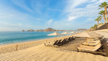 On the beach, sun loungers, beach towels
