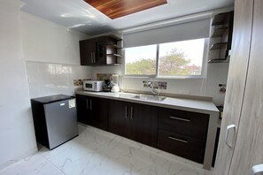 Superior Studio | Private kitchen | Mini-fridge - Villa Santos Apartaestudios (Barranquilla)