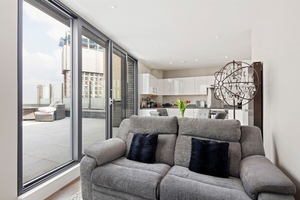 Basic Apartment, Multiple Beds | Living room | TV