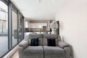 Basic Apartment, Multiple Beds | Living room | TV
