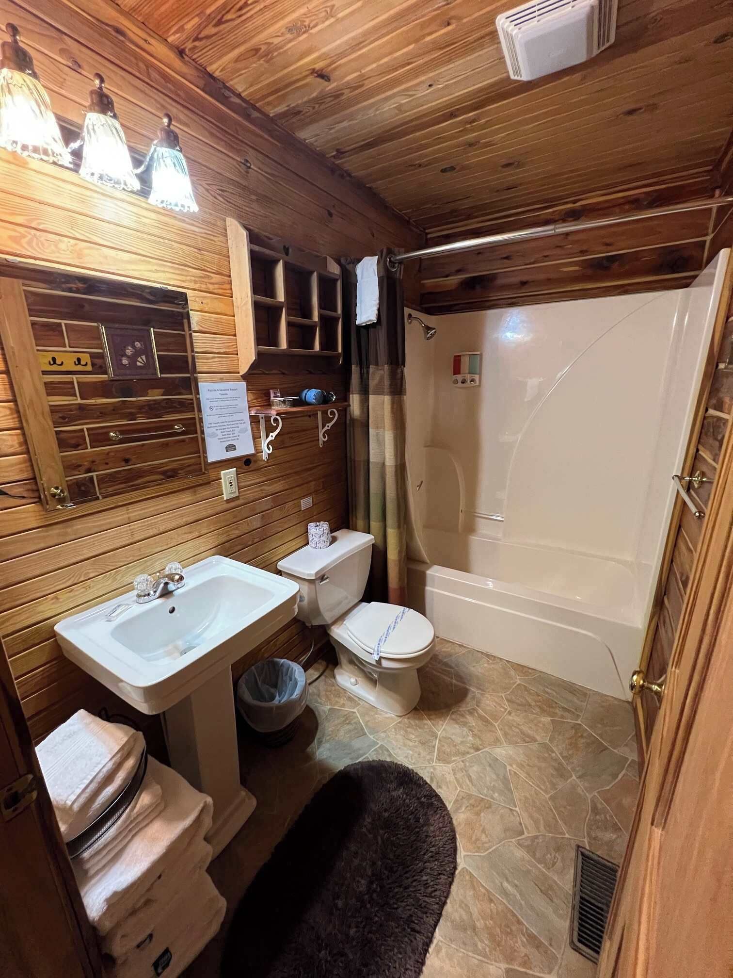 Combined shower/bathtub, hair dryer, towels, soap