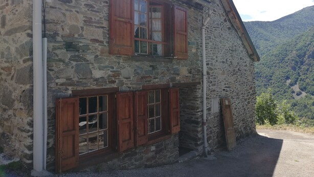 A stone building with wooden shutters and a window. - Maison Le Pijoulet, Dream vacation in Ariege (TIGNAC)