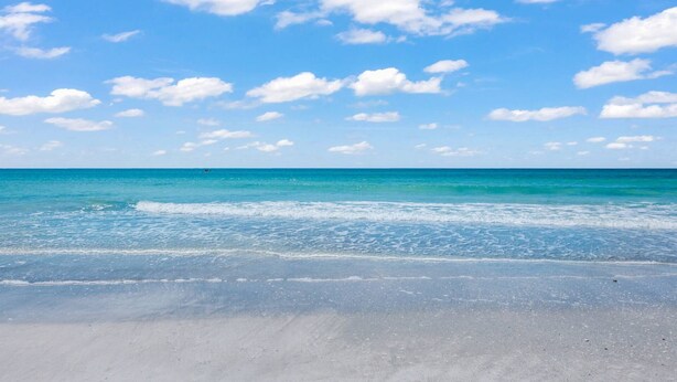 A beach with clear blue water and a sandy shore. - Harbor Towers 2nd Fl 2 Bedroom Pool View (Siesta Key)