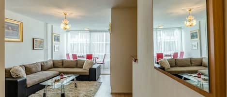 Comfort Apartment | Living area | 55-inch LCD TV with cable channels, TV