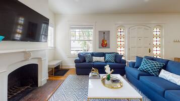 Smart TV, fireplace, books, printers