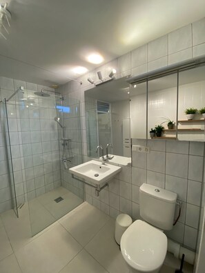 Bathtub, hair dryer, towels, soap