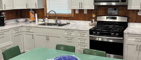 Fridge, microwave, stovetop, coffee/tea maker