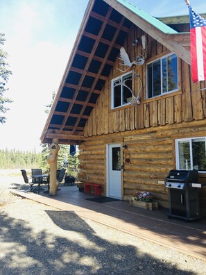 Outdoor dining - Log House on Denali Airstrip at Mile Post 229.5 of the Parks Highway. (Denali National Park and Preserve)