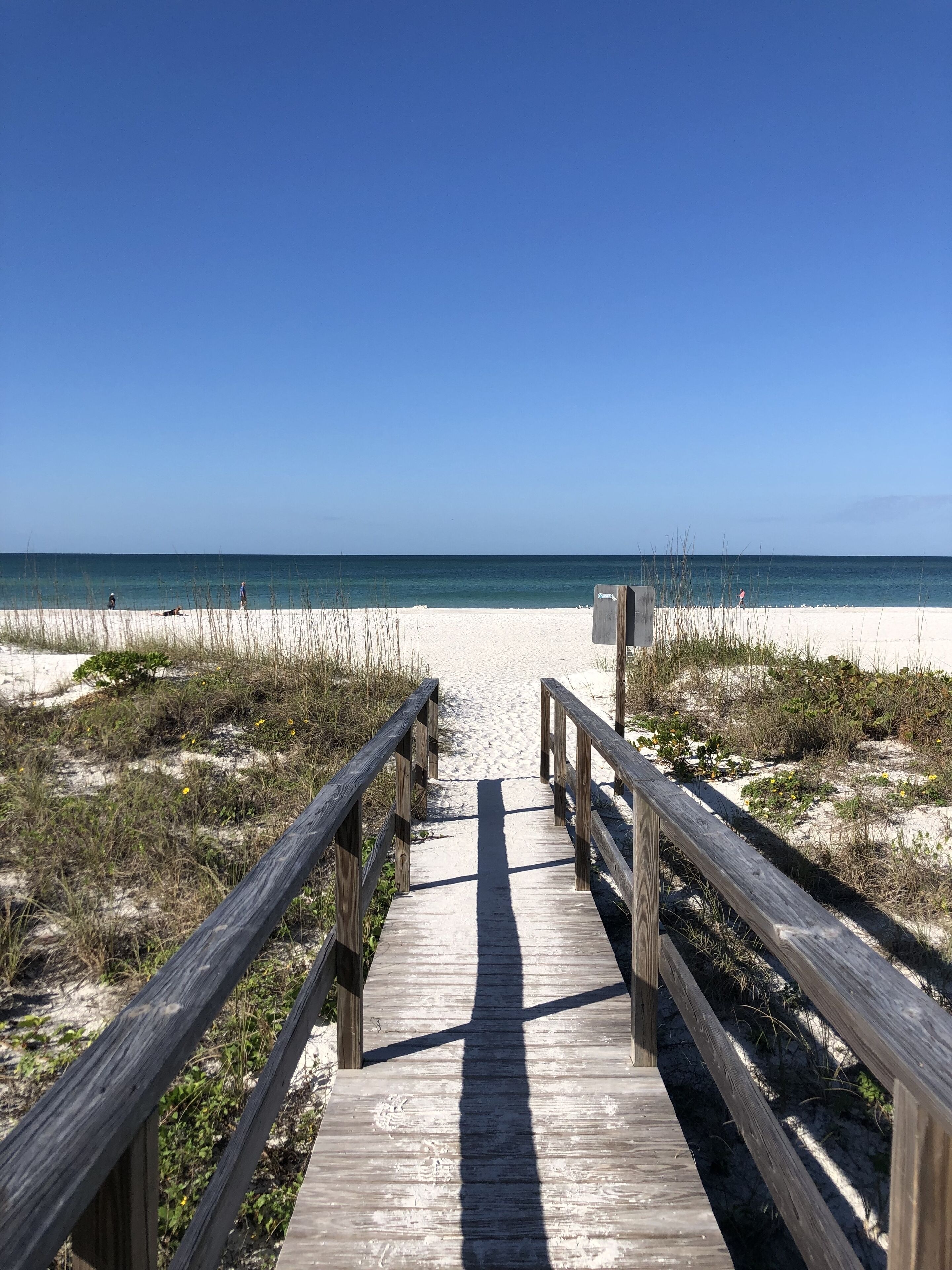 Steps to the beach and park. This is the rear unit with private deck! 