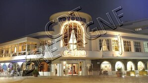 A casino with a prominent entrance, multiple levels, and a classic architectural design.