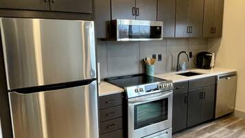 Coffee/tea maker, microwave, dishwasher, cookware/dishes/utensils