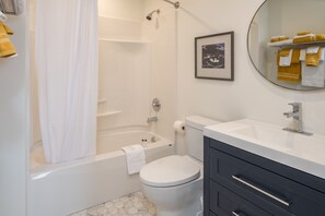 Combined shower/tub, hair dryer, towels, soap