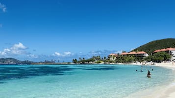 On the beach, sun loungers, beach towels