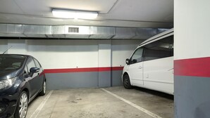 A parking garage with two cars parked in adjacent spaces. - Vacation Home "Apartamento Vistas de Icod" with Mountain View, Sea View & WiFi (Icod de los Vinos)