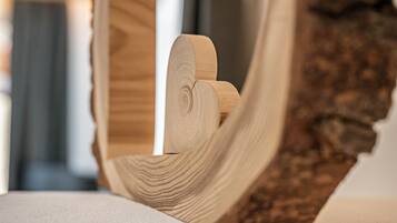 A close-up of a wooden object with a natural grain pattern, possibly a piece of furniture or decor.
