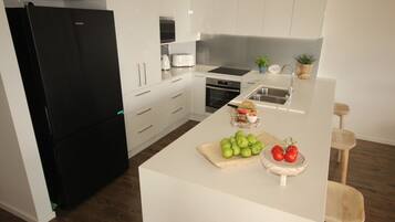 Apartment | Private kitchen | Full-size fridge, microwave, oven, stovetop
