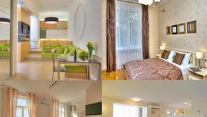 Habitació d'hotel amb un llit, una televisió, un escriptori i una zona de menjador.