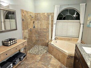 Bathtub, hair dryer, towels, soap