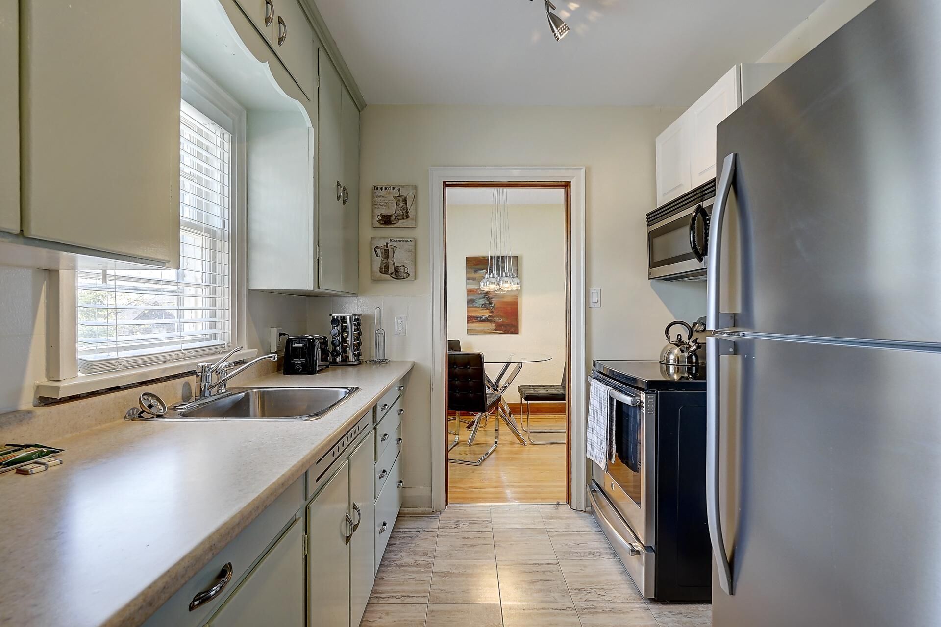 Bright & Airy Second Floor Apartment with Lovely Backyard & Off Street Parking!