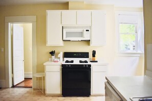 Fridge, stovetop, dishwasher, coffee/tea maker