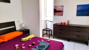 A hotel room with a bed, a dresser, a chair, and a window. - El cortijo, pool view (Costa Adeje)