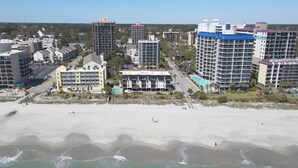 A coastal cityscape with high-rise buildings, a beach, and a clear sky. - Long Bay Dunes A3-Oceanfront Condo in Myrtle Beach (Myrtle Beach)