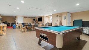 A pool table in a room with a dining area and a television. - ONE MINUTE WALK to WELLS BEACH, Bellevue by the Sea is your perfect vacation! (Wells)