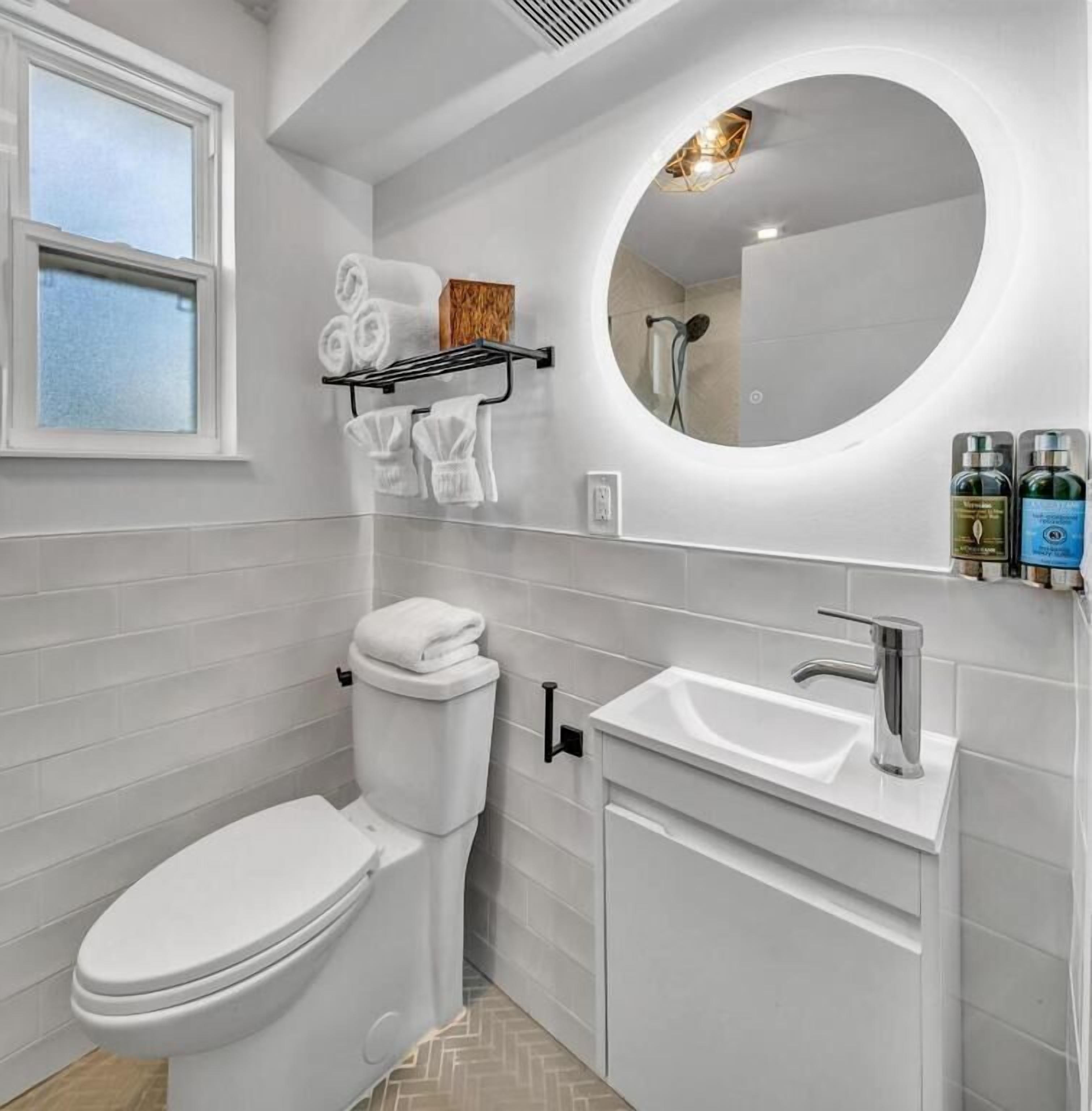 shower, hair dryer, bathrobes, slippers